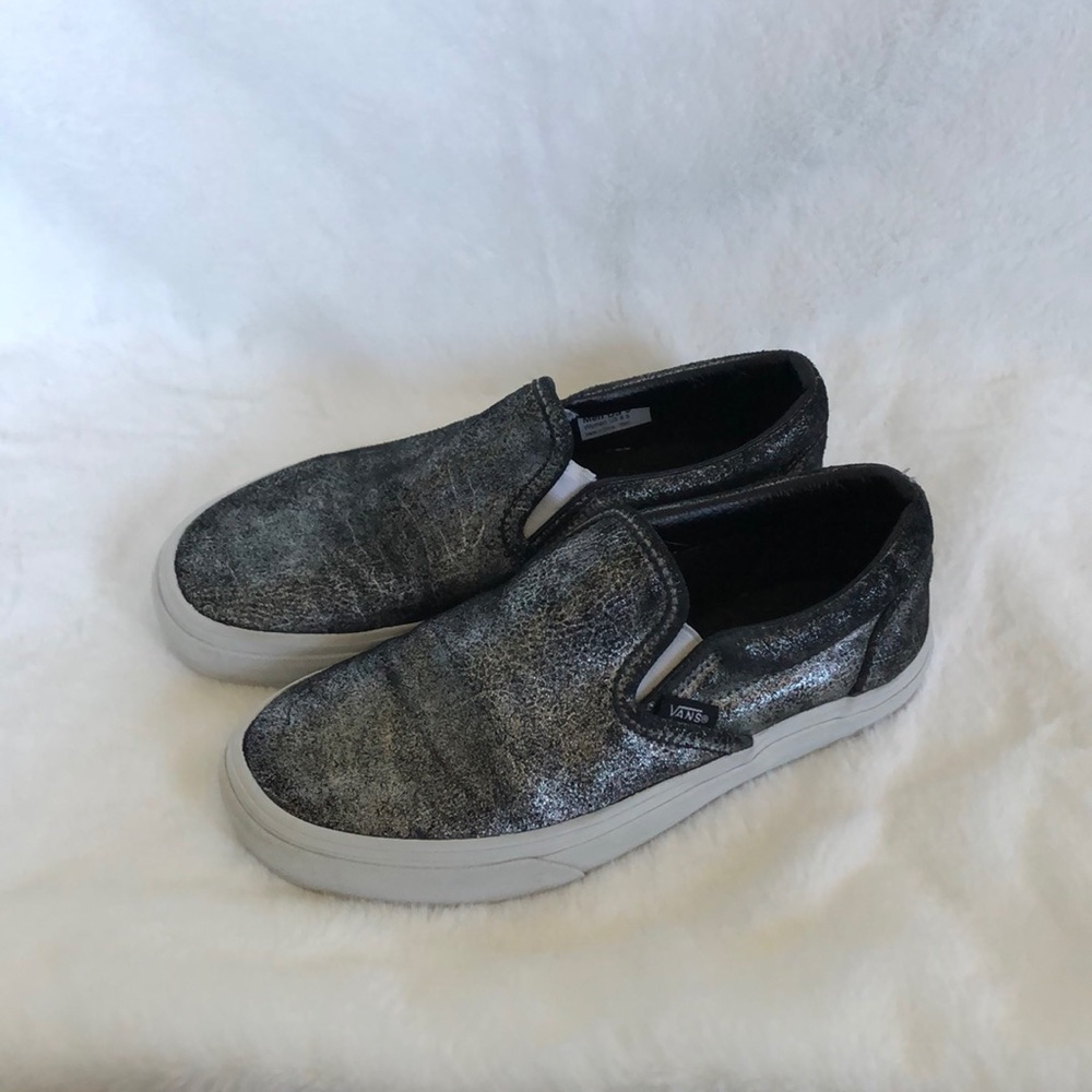 Black and silver slip-on vans